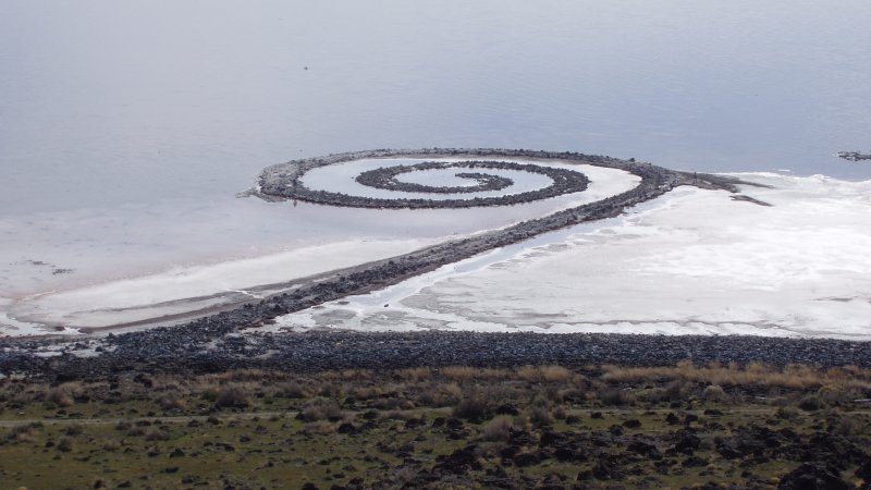 Photo from Wikipedia
Made of mud, salt crystals and basalt, Robert Smithson’s “Spiral Jetty” is an example of Land Art from the 1970s. It’s still there on the Rozel Peninsula at the Great Salt Lake. The owner, the Dia Art Foundation, says it’s completely visible due to the drought.